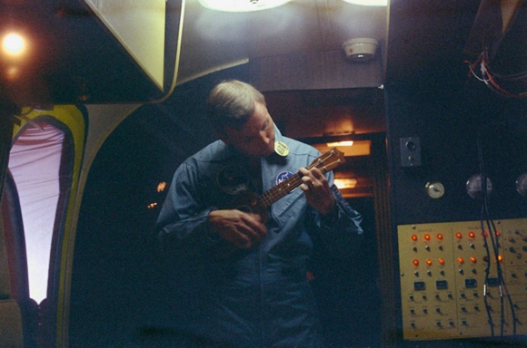 Astronaut Neil Armstrong strumming his Ukulele while in isolation upon returning from the moon in 1969.